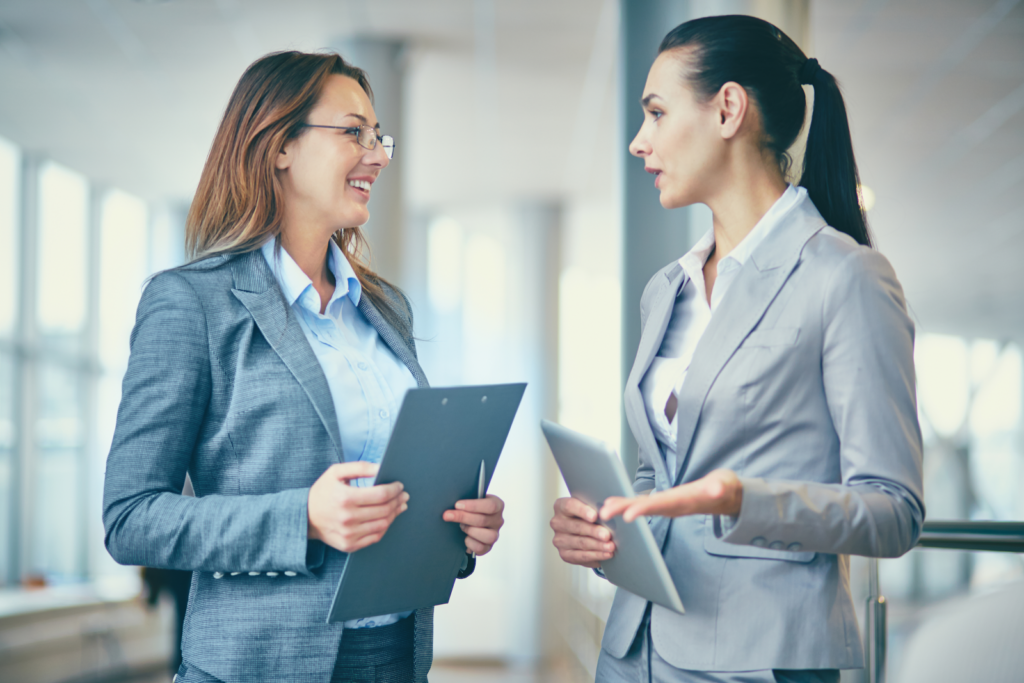 two business women talking
